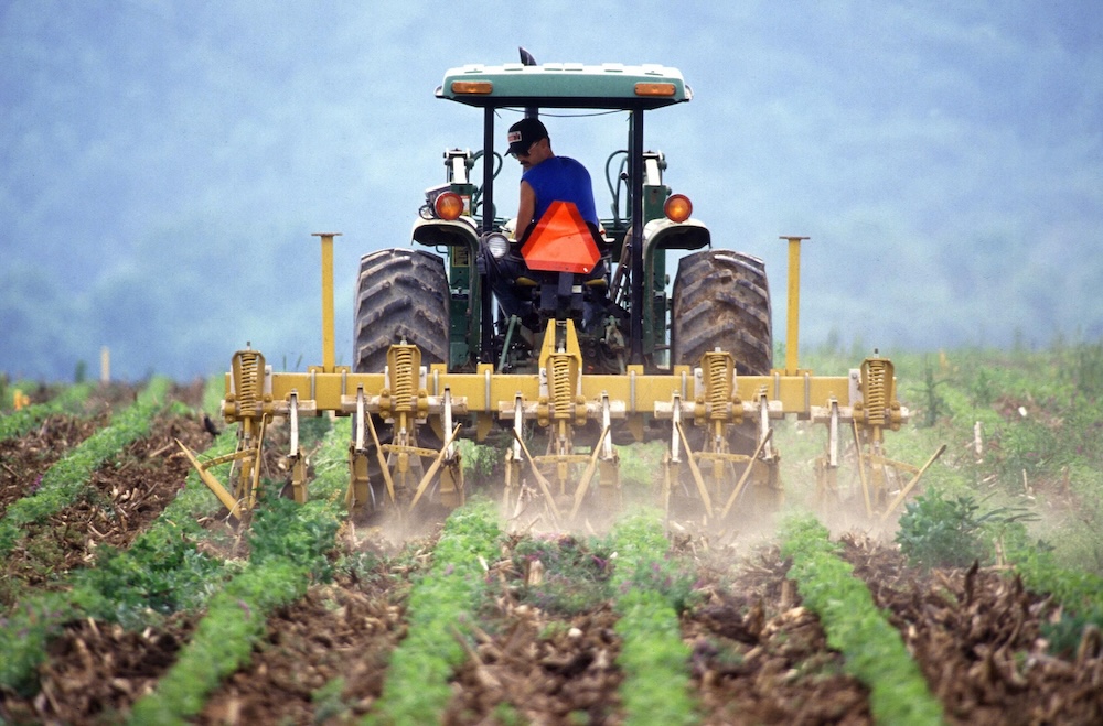 farm tractor tilling field